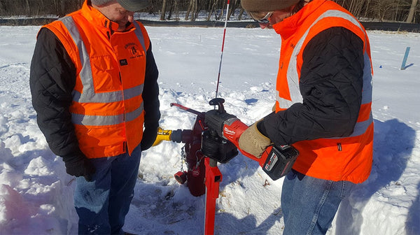 Photo of two men using the Hydrant Buddy by HydroVerge